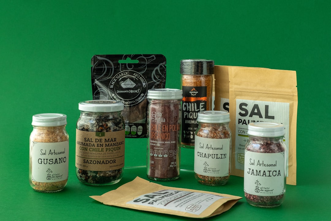 A variety of spices and seasonings on a green background