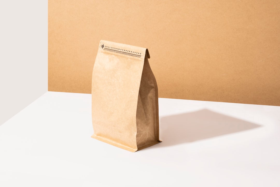 a brown paper bag sitting on top of a white table