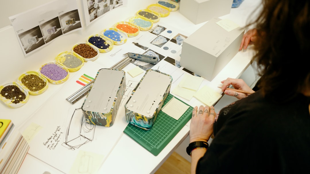 private label packaging - a woman working on a project at a table