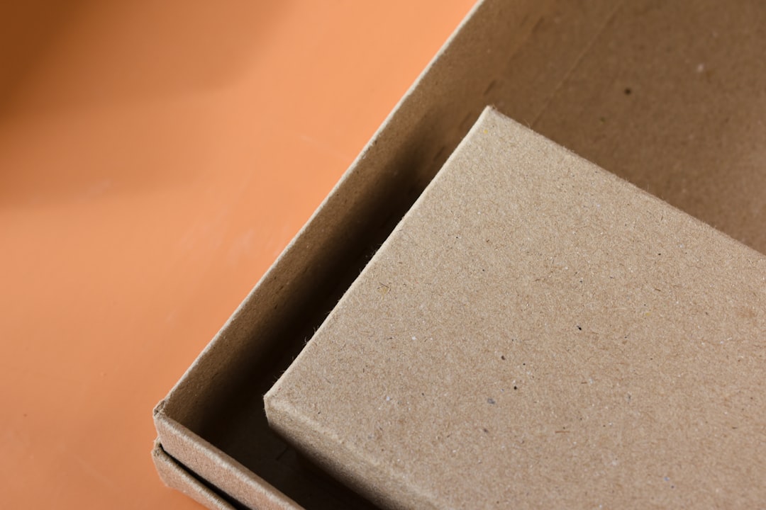 sustainable packaging materials - an open cardboard box sitting on top of a table