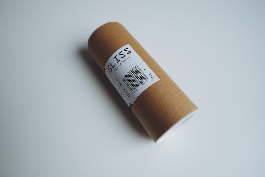Brown cardboard tube with a label