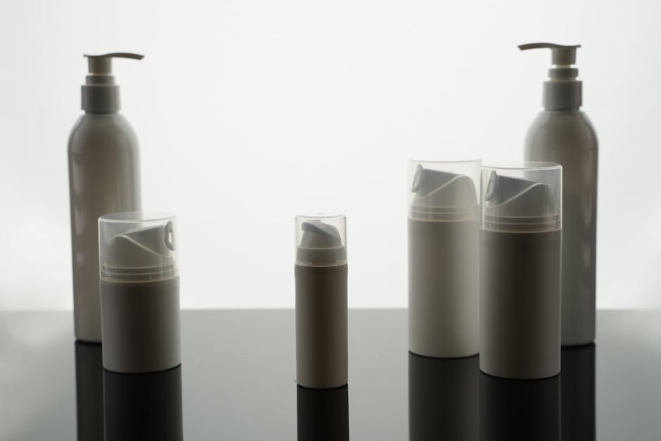 cosmetic packaging trends - Stylish arrangement of empty bottles for product display in a minimalist style.