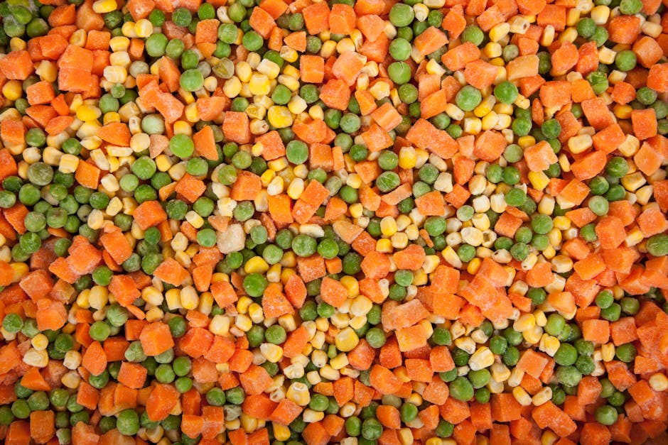 frozen food packaging - A vibrant mix of frozen carrots, peas, and corn showcasing healthy eating options.
