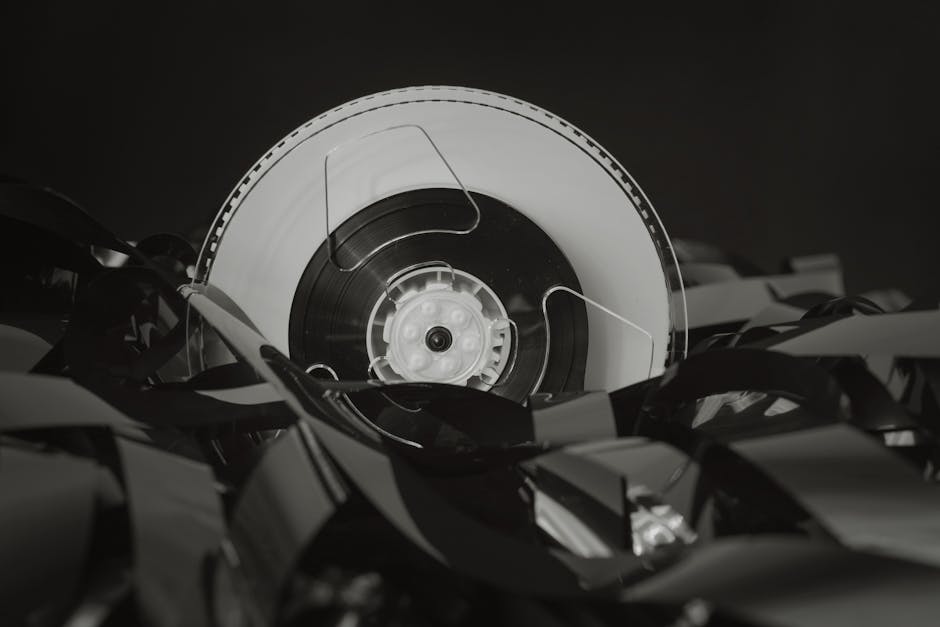 electronics packaging - Close-up of a vintage cassette tape against a black background, showcasing retro technology.