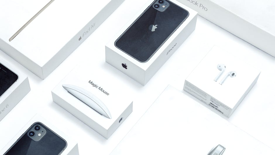 electronics packaging - Flat lay of assorted Apple product boxes showcasing technology packaging design.